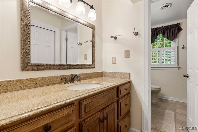 Bathroom with vanity and tile patterned floors | Image 35