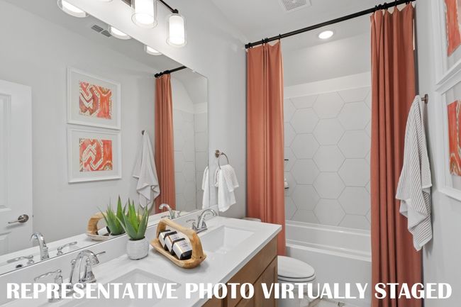 Guests will enjoy their own vanity space in this lovely guest bath! REPRESENTATIVE PHOTO VIRTUALLY STAGED | Image 14