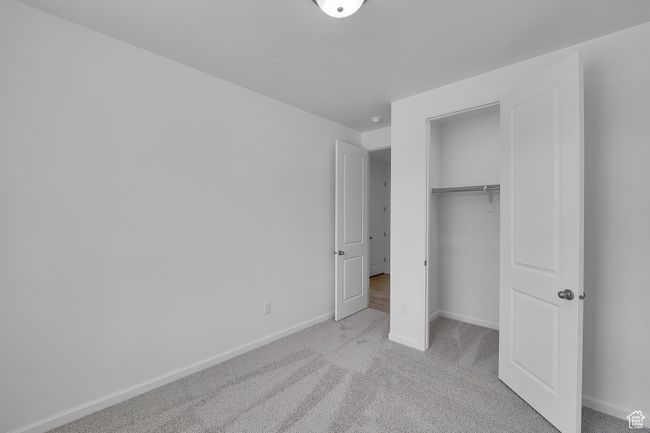 Unfurnished bedroom with carpet and a closet | Image 15