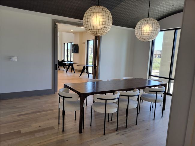 Dining area featuring light wood-type flooring and baseboards | Image 28