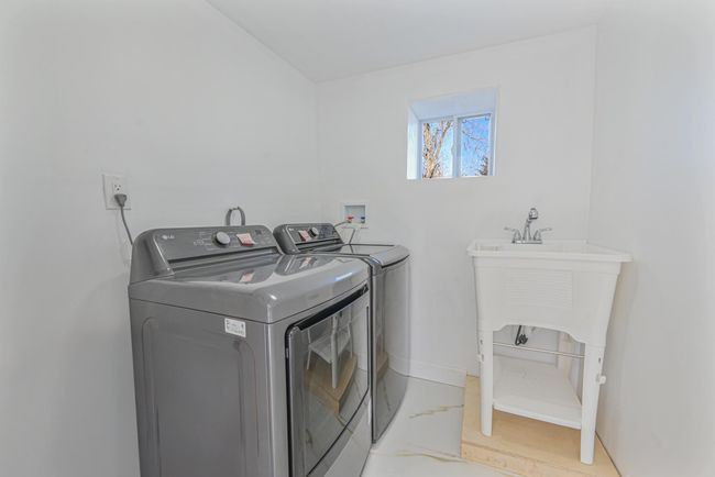 Clothes washing area featuring washer and dryer | Image 42