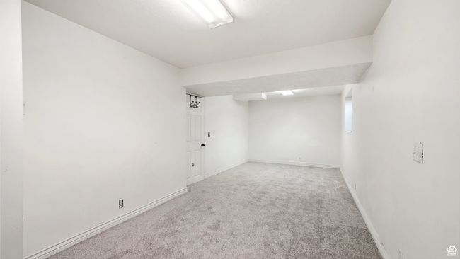 Unfurnished room featuring baseboards and carpet | Image 21