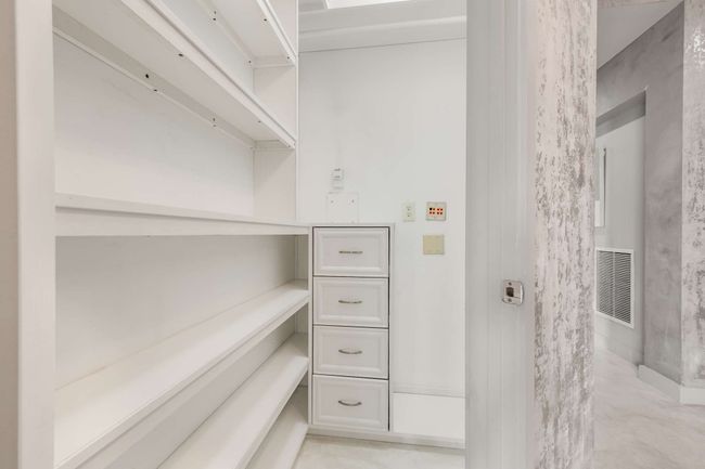 There's so much extra storage with custom closets. This could be an extra pantry or additional storage. | Image 13
