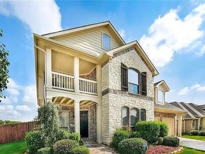 View of front of property with a garage and a balcony | Image 2