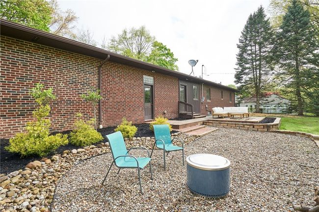 Back of house with brick siding and a patio | Image 28
