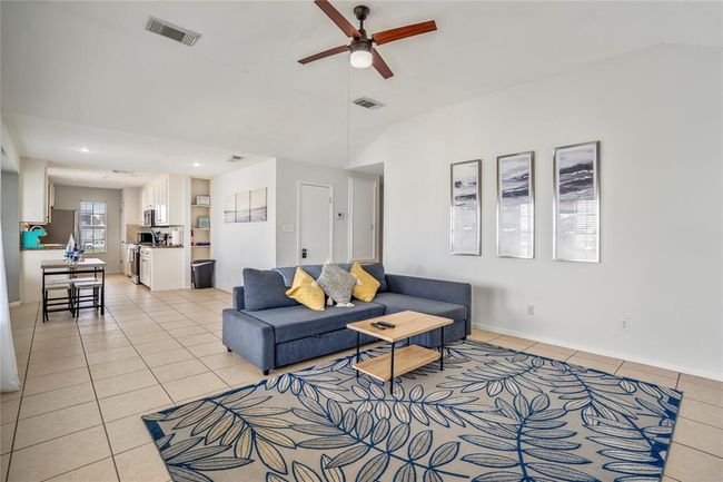 Spacious living room connected to dining and kitchen. | Image 5