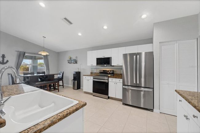 12359 Deepwoods Ave, House other with 4 bedrooms, 2 bathrooms and null parking in Port Charlotte FL | Image 12