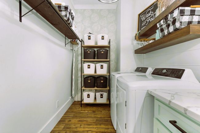 Laundry room with shelving and clothes line | Image 69