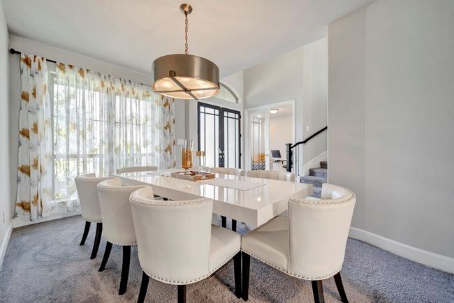 Dining room is open to the Butler's Pantry which leads to the kitchen. Entertaining is a breeze! | Image 7