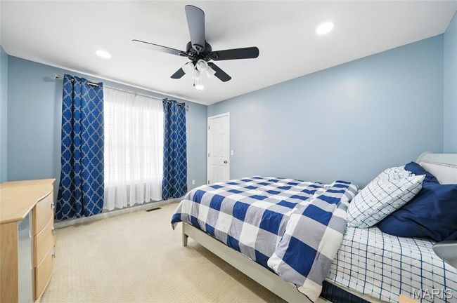 Carpeted bedroom with recessed lighting and a ceiling fan | Image 16