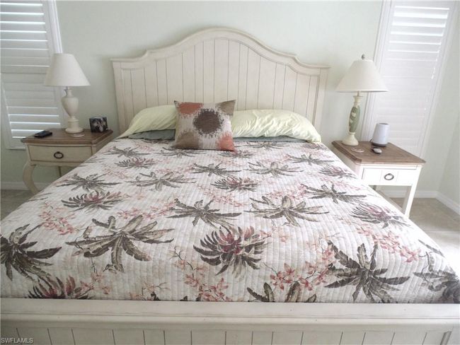 Tiled bedroom featuring baseboards | Image 15