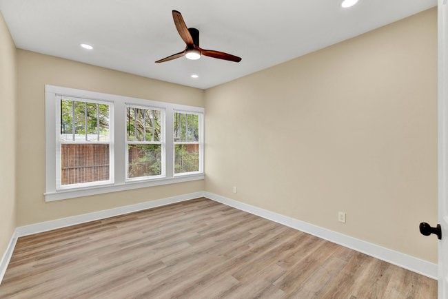 Spare room with ceiling fan, recessed lighting, light wood finished floors, and baseboards | Image 19