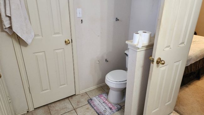 Bathroom featuring tile patterned flooring and toilet | Image 15