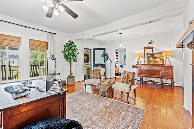 Living area featuring ceiling fan, light wood-type flooring, and ornamental molding | Image 12
