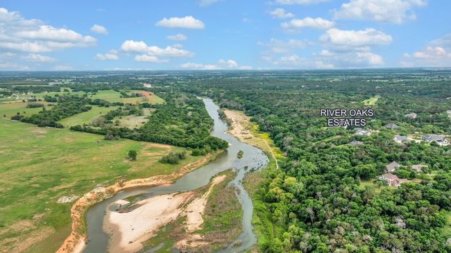 Drone / aerial view with a view of trees and a water view | Image 36