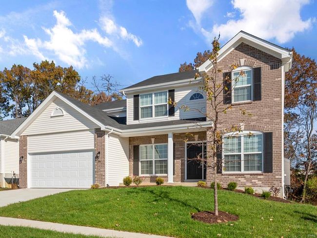 Front of property featuring a front yard and a garage | Image 4