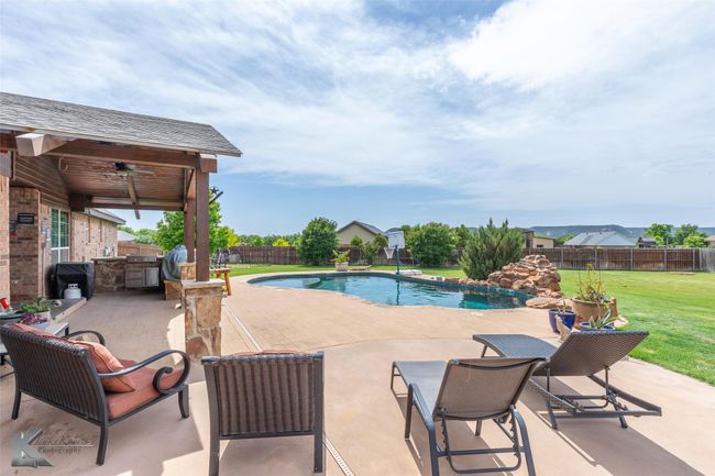 View of swimming pool featuring a patio | Image 34