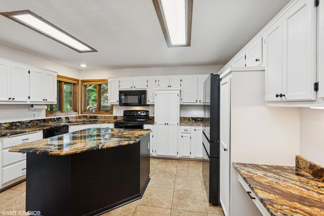 Double windows over the sink let in natural light—and give you a perfect view of the backyard | Image 13