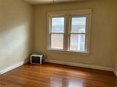 Unfurnished room with light wood-type flooring | Image 3