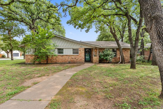 Single story home with brick siding and a front yard | Image 32