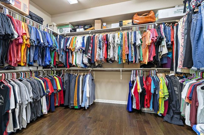 Spacious closet featuring wood finished floors | Image 19