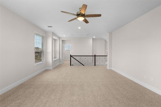 Unfurnished room featuring attic access, ceiling fan, light carpet, recessed lighting, and baseboards | Image 26