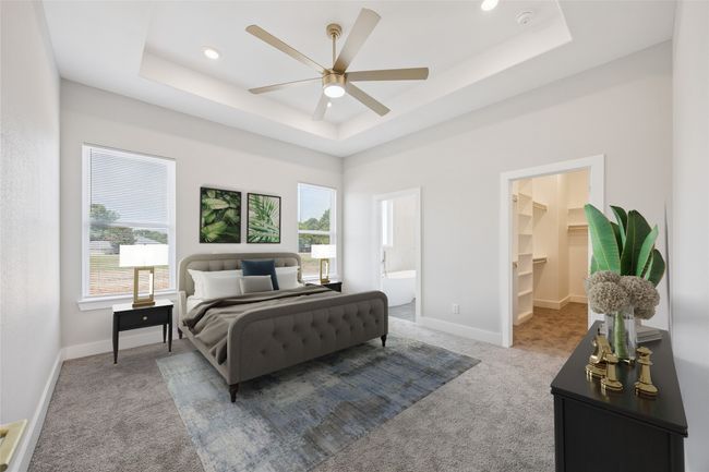Virtual Staging - Carpeted bedroom with a tray ceiling, a spacious closet, recessed lighting, ensuite bath, and a ceiling fan | Image 5