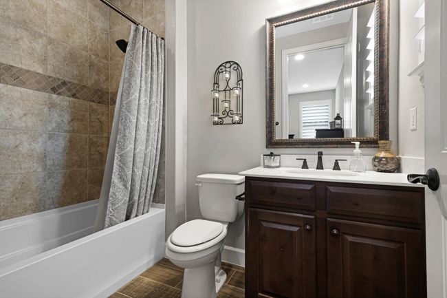 Full bath with vanity, shower / tub combo, and toilet | Image 21