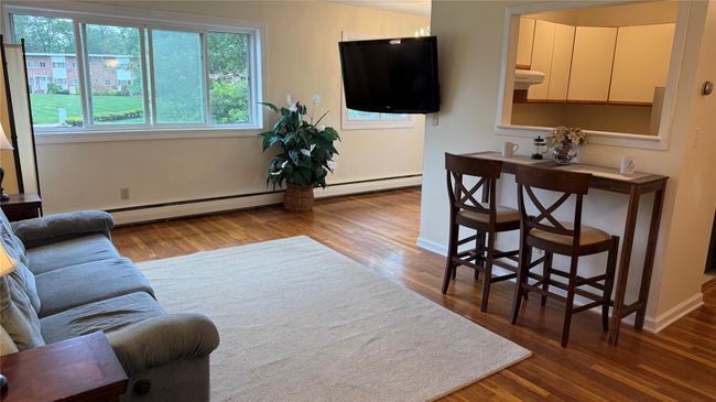 Living room featuring Hard wood floors, Eating Area | Image 4