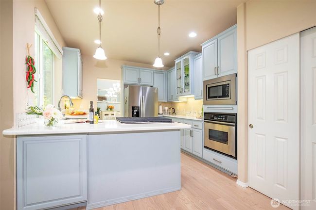 Kitchen with newer Stainless-Steel Appliances & Pantry. | Image 11