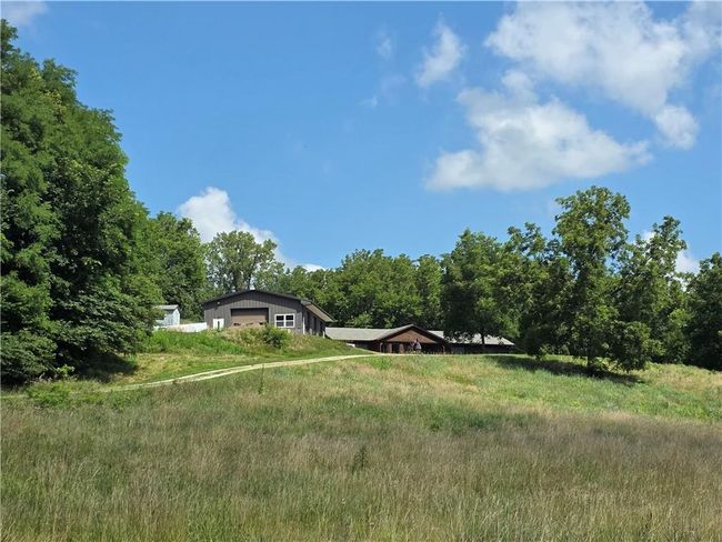 View of yard featuring a garage | Image 4