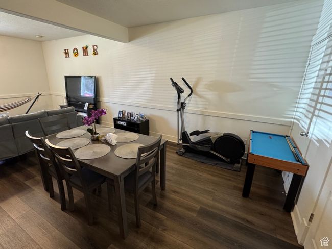 Dining room with wood finished floors | Image 6