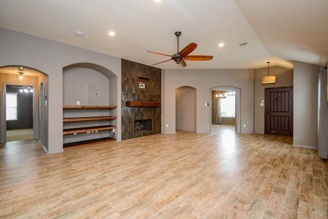 Equipped with a gaslog fireplace, this space is the heart of thiscomfy home. | Image 5
