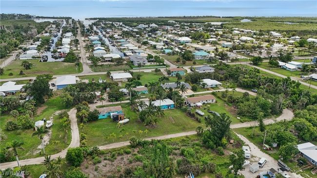 Aerial overview of property's location with nearby suburban area | Image 42
