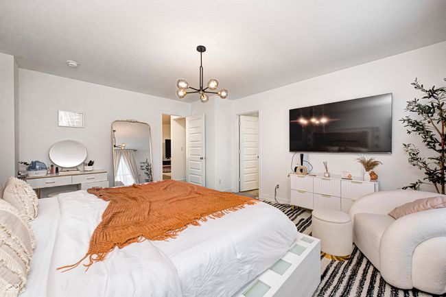 bedroom featuring a chandelier | Image 26