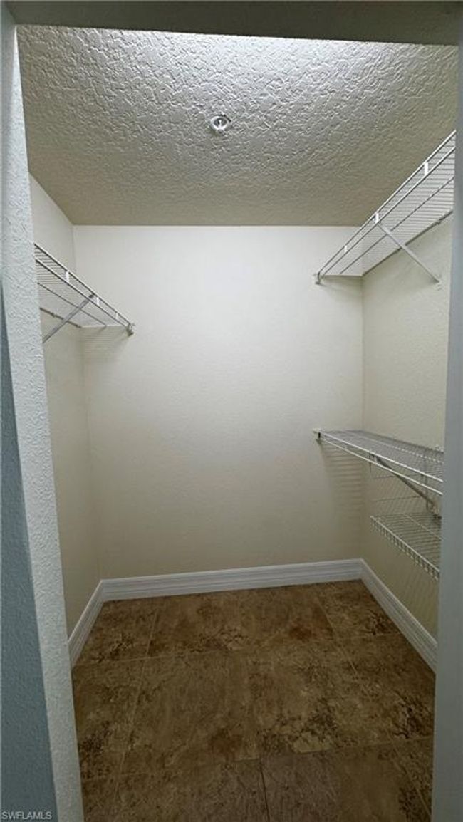 View of walk in closet | Image 4
