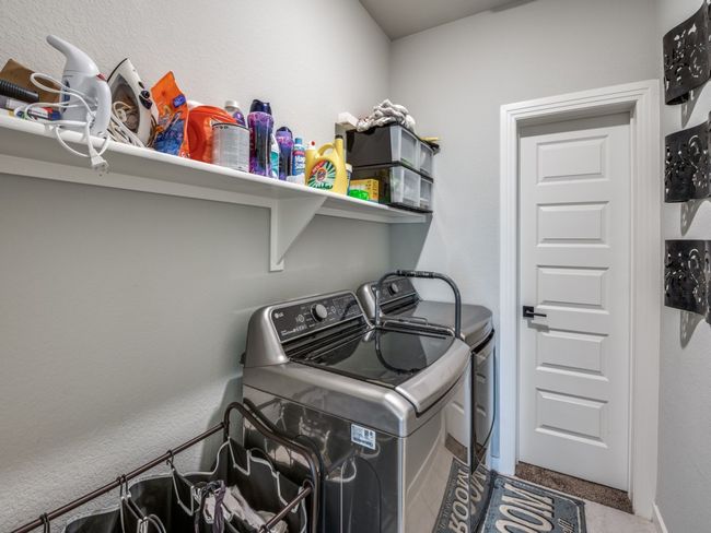 Washroom with carpet flooring, laundry area, and independent washer and dryer | Image 31