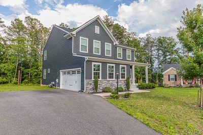 View of front of property with a garage and a front yard | Image 3