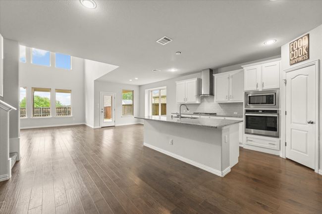 Kitchen, living room and dining room are all open to each other. | Image 6