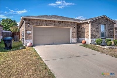 4 sides brick/stone, gutters, landscaping, privacy fenced back yard. | Image 2