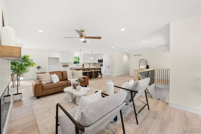 Living room with ceiling fan, light wood-style floors, and recessed lighting | Image 9