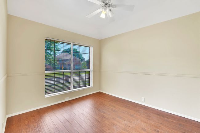 bedroom 1 featuring ceiling fan and hardwood / wood-style floors | Image 14