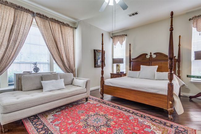Large primary bedroom located on the first floor with two large closets, one located in the bedroom, and one located in the primary bathroom. | Image 16