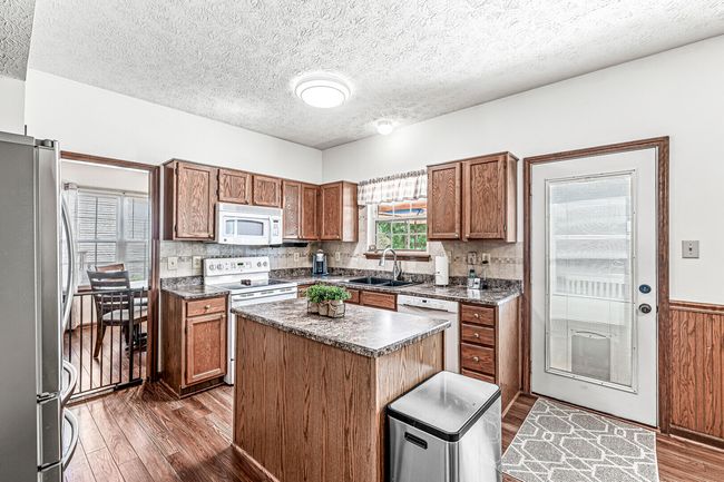 Main Floor Kitchen With access to the lovely Deck | Image 8