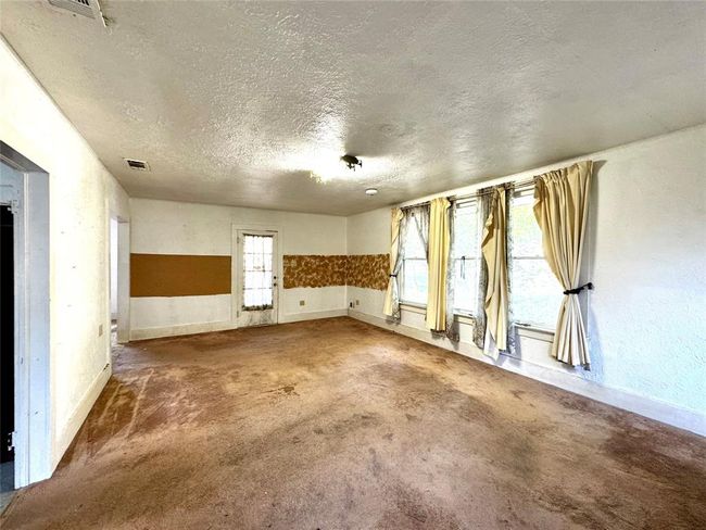 Entry door into the living room | Image 10