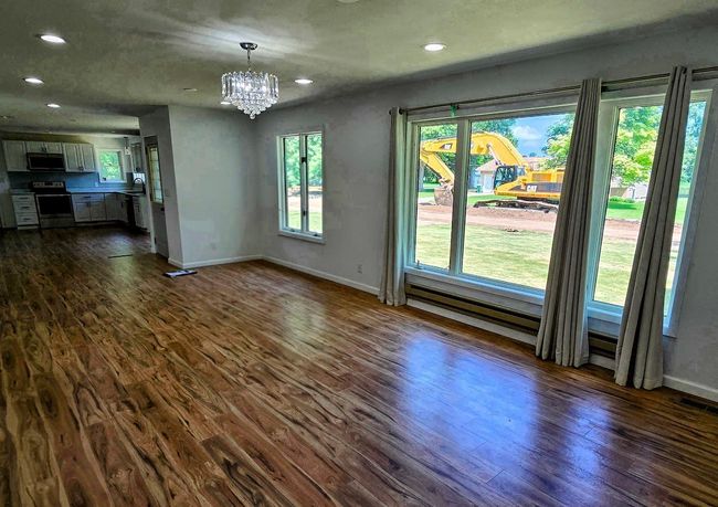 Front door & north side of house (you can see street work being done) | Image 8