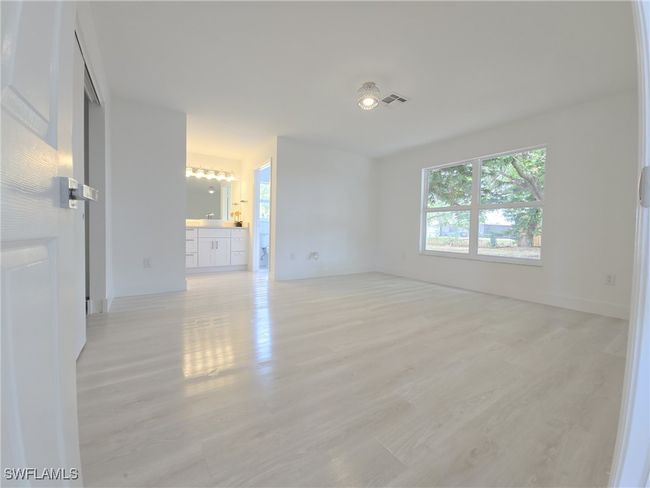Unfurnished room featuring light wood-style floors and baseboards | Image 27