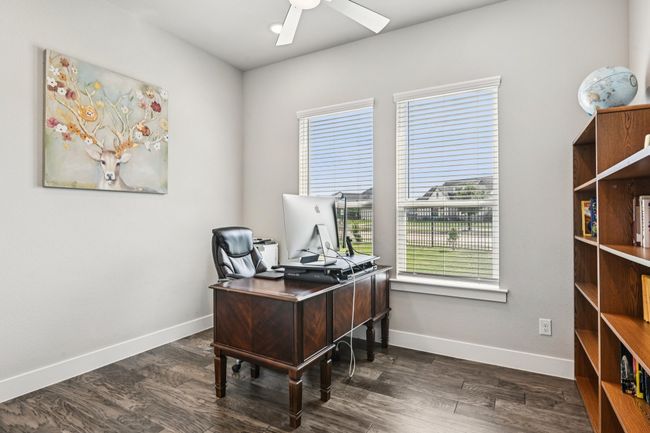 Home office with plenty of natural light, a ceiling fan, and dark wood-type flooring | Image 14