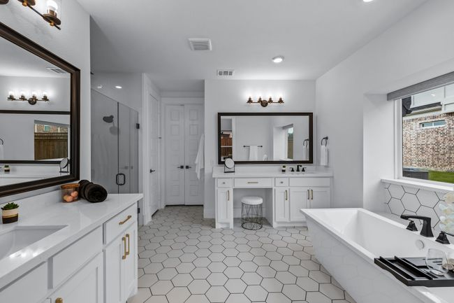Bathroom featuring plus walk in shower, tile patterned flooring, and double sink vanity | Image 21