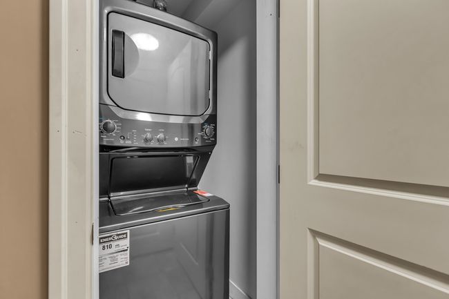 Laundry area with estacked washer and dryer | Image 29